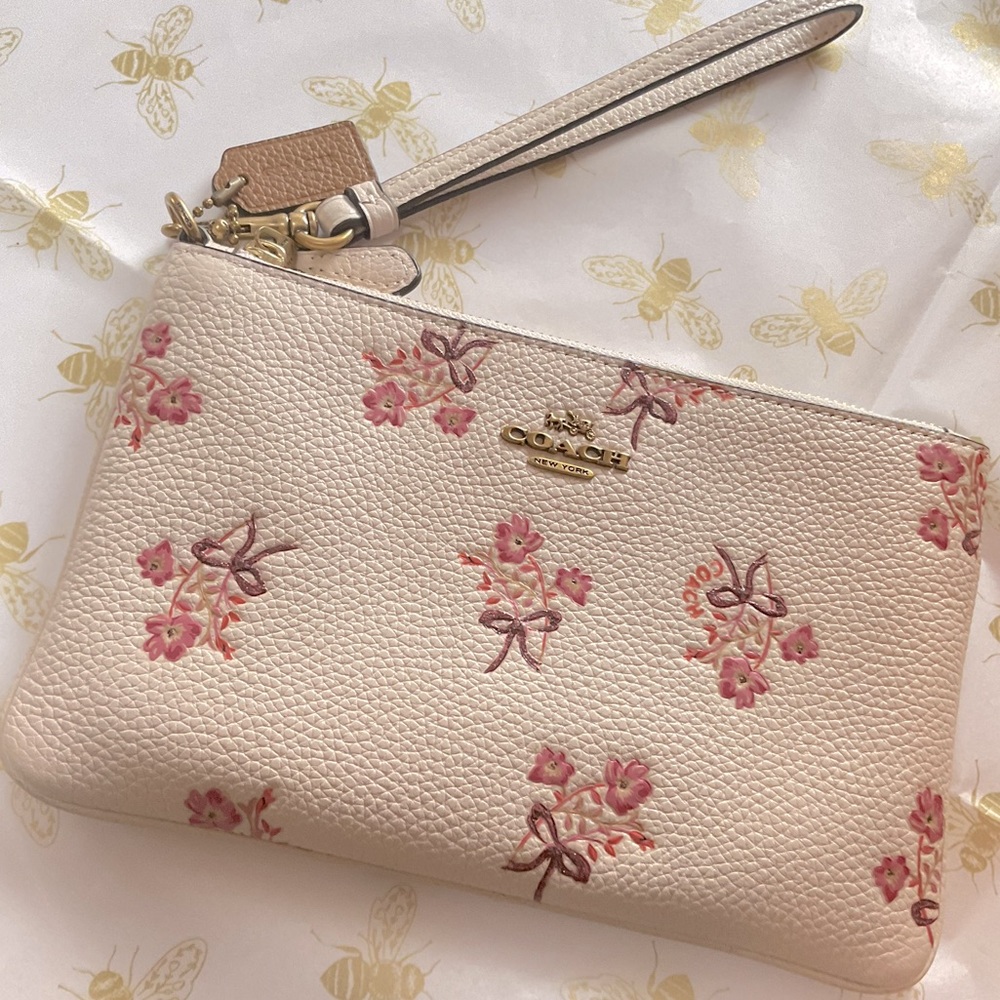 Beautiful Coach embossed leather floral zippered wristlet